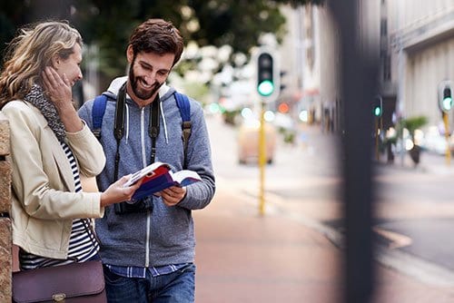 Couple Looking at Travel Guide