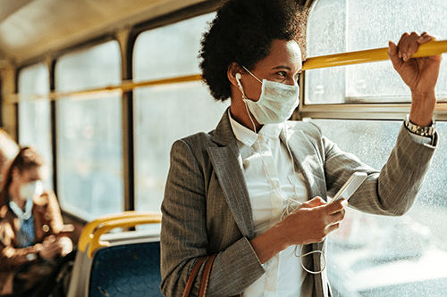 Woman on bus with mask